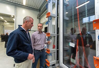 Dr. Peter Mrosik, owner and CEO of profine (left), with workshop manager Thomas Schuster at a newly installed test rig.